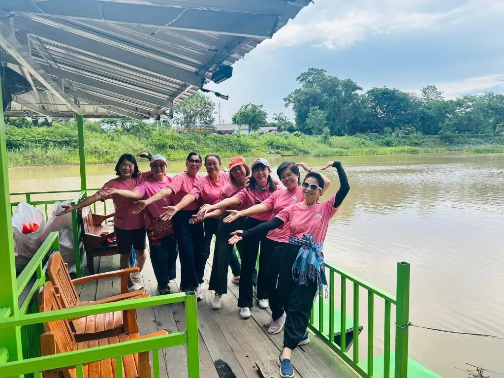 Private longtail charter boat floating on the peaceful Nam Ing river in Chiang Rai